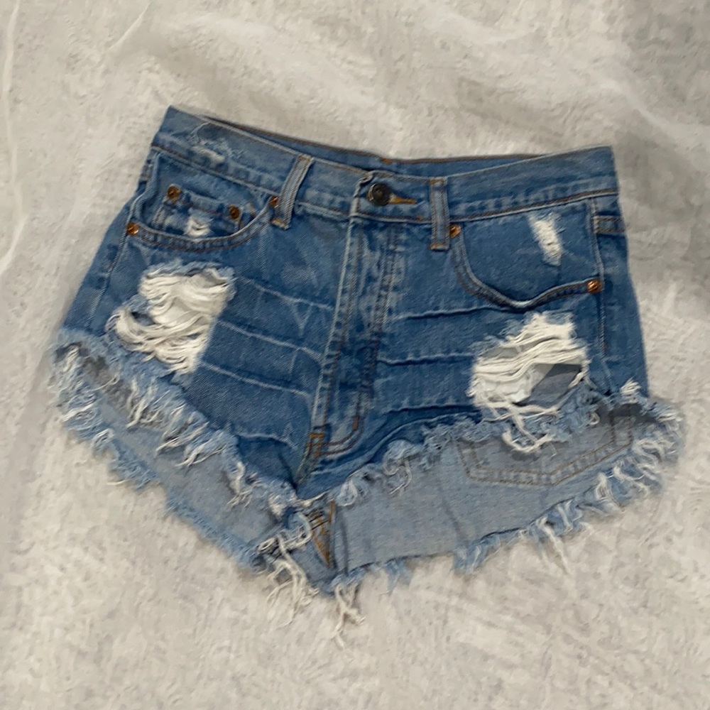 Distressed medium wash high rise jean shorts
